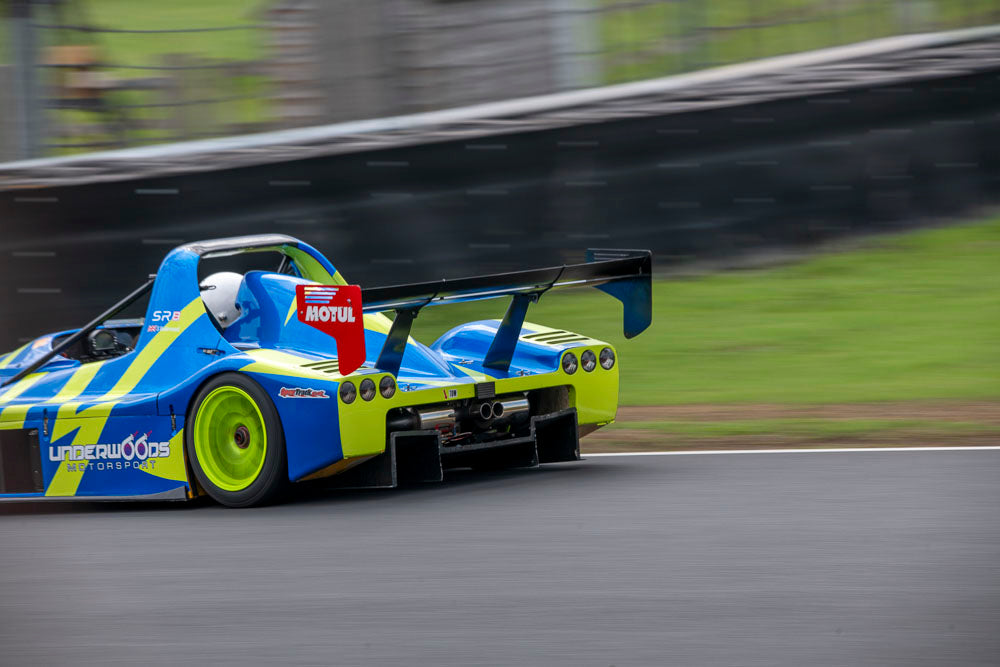 Yellow and blue car on track