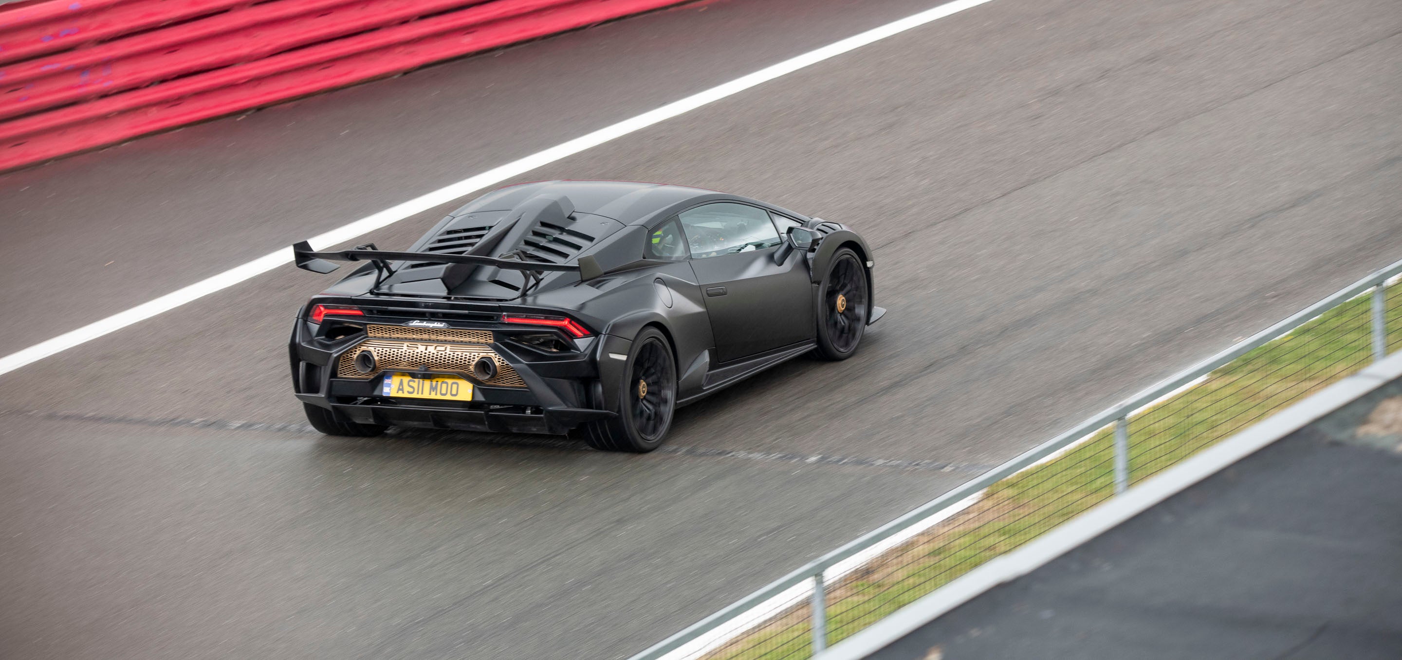 Black sports car on a racetrack